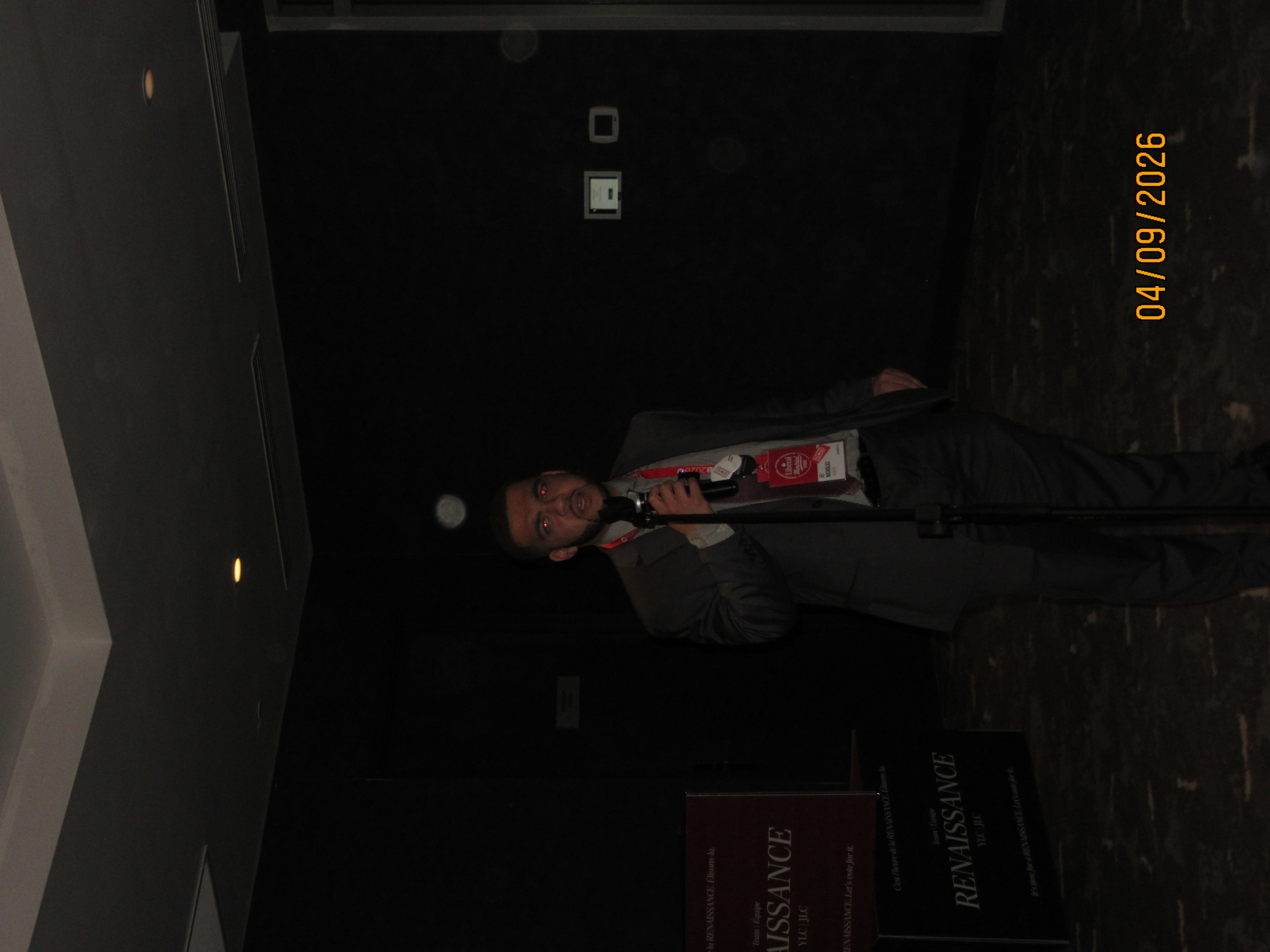 Nich speaking at an event